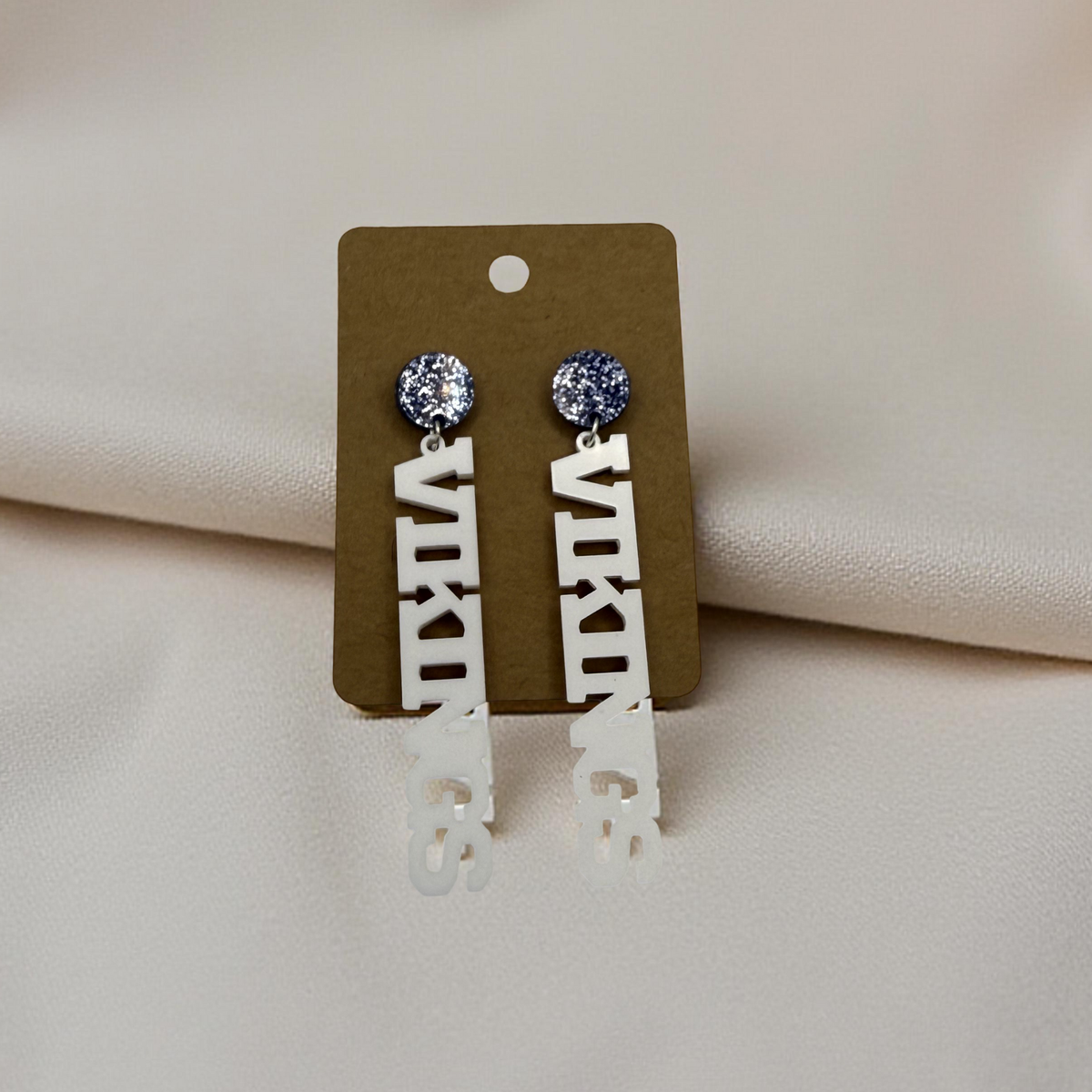 Vikings Vertical Acrylic Earrings | Blue Glitter Stud Top + White Lettering