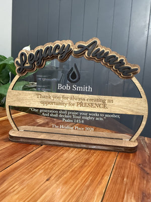 Acrylic recognition award with a wood ring and engraved wood banner reading Thank you for always creating an opportunity for presence