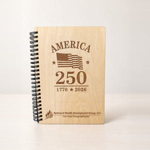 Laser engraved birch wood spiral notebook with a black spiral, America 250 design and a company logo